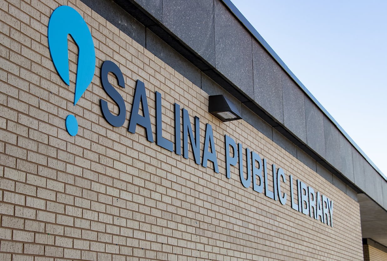metal letters spelling Salina Public Library appear on the brick front of the building